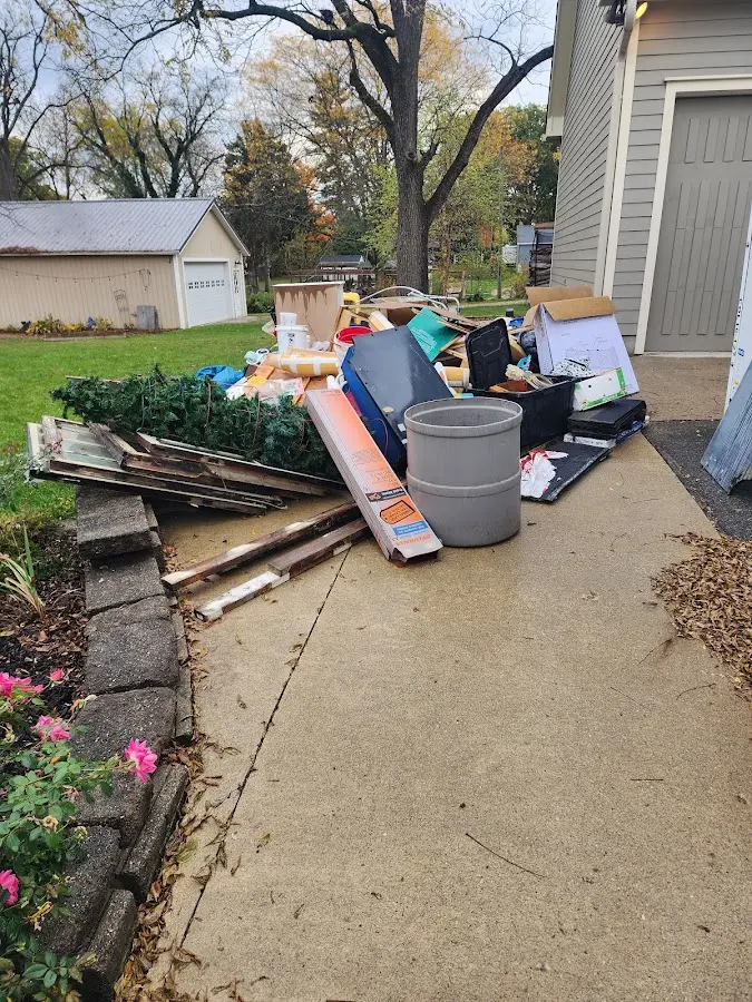 Dumpster being loaded with debris for Roofing Dumpster Rental in North Chicago